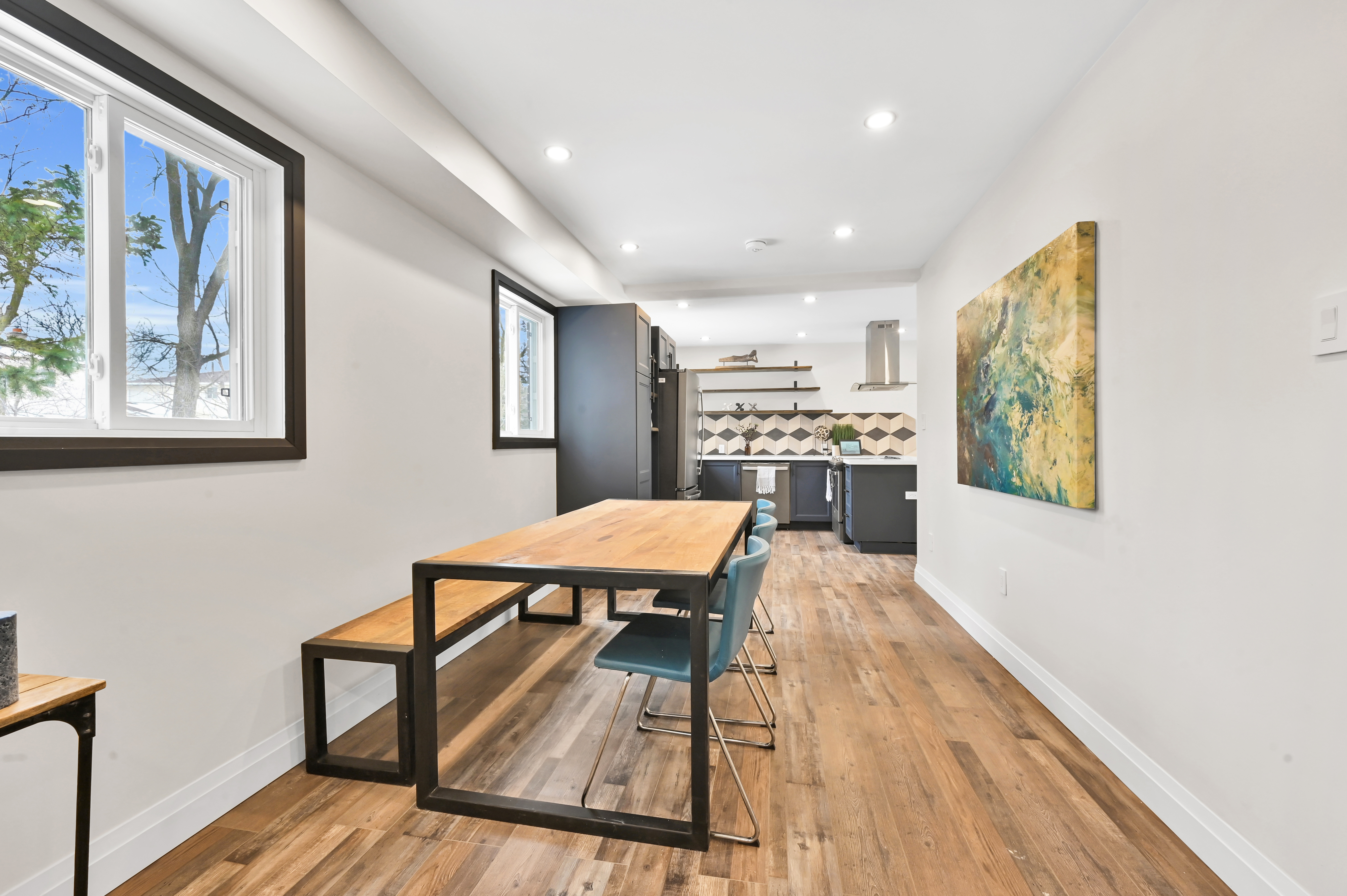 Bright modern dining/living space with beautiful wood flooring and clean staging — Kron, Hamilton | MTC Renovations
